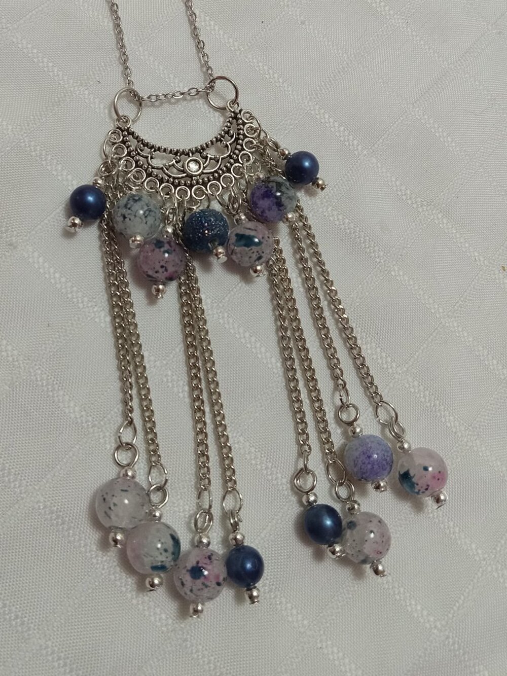 Exquisite handmade necklace featuring a half-moon-shaped Tibetan silver charm